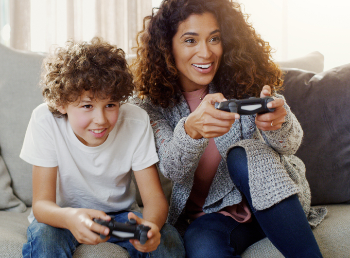 Mother and son play video games, creating healthy screen time habits