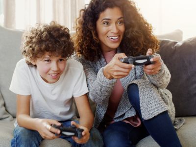 Mother and son play video games, creating healthy screen time habits